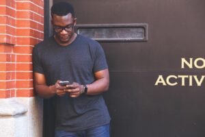 man black man mobile phone person 1868730